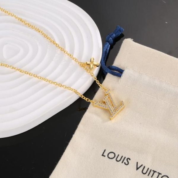 LOUIS VUITTON gold letters